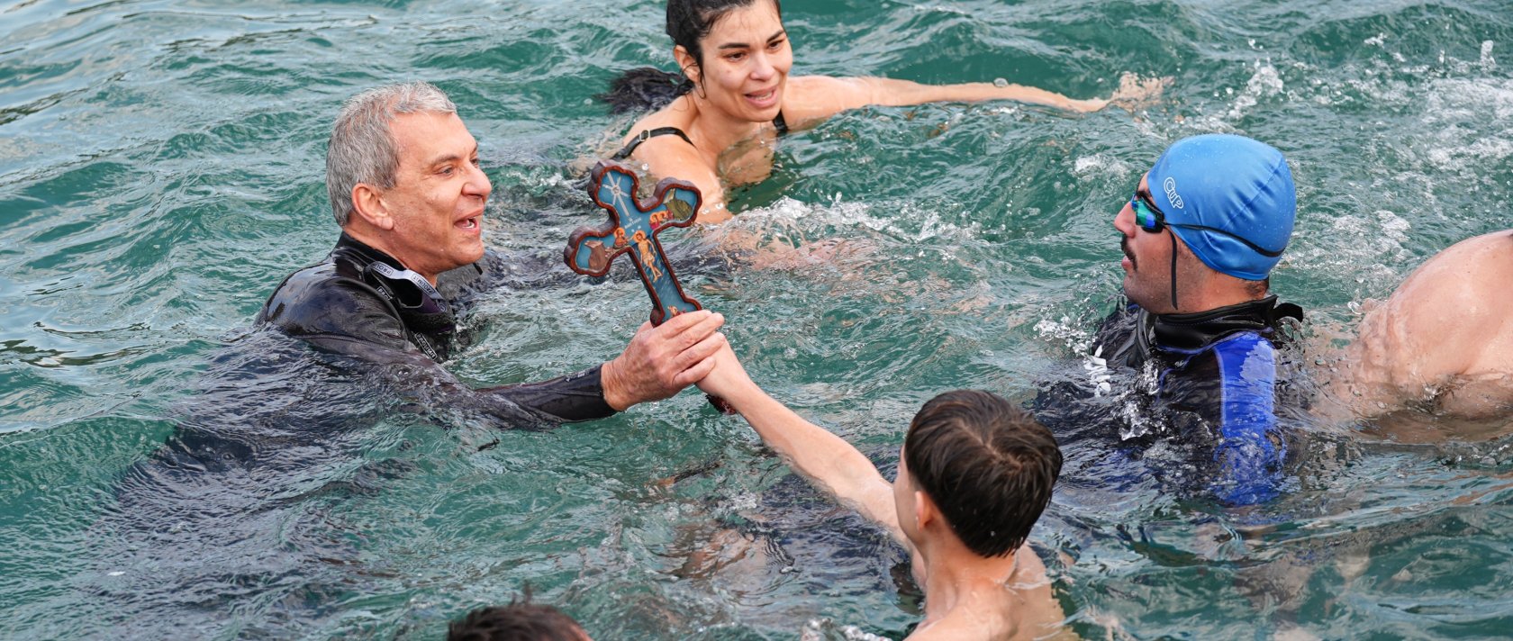 Orthodox Christians perform a traditional cross-diving ceremony at Moda Pier in Kadıköy, Istanbul, Türkiye, Jan. 6, 2025. (AA Photo)