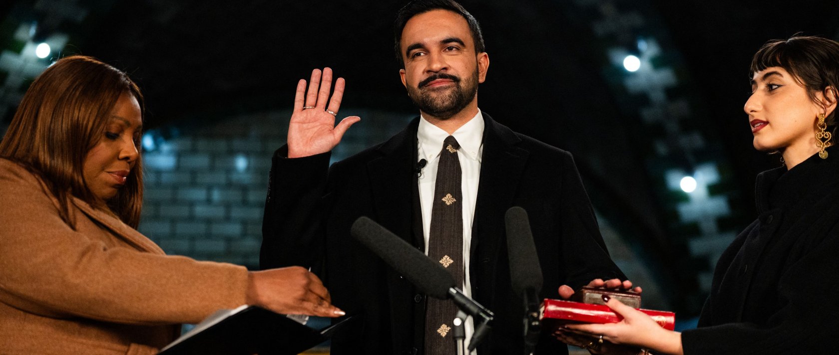 New York Mayor-elect Zohran Mamdani (C) places his hand on a Quran as he is sworn in by New York Attorney General Letitia James (L) and his wife Rama Duwaji looks on, New York, U.S., Jan. 1, 2026. (AFP Photo)