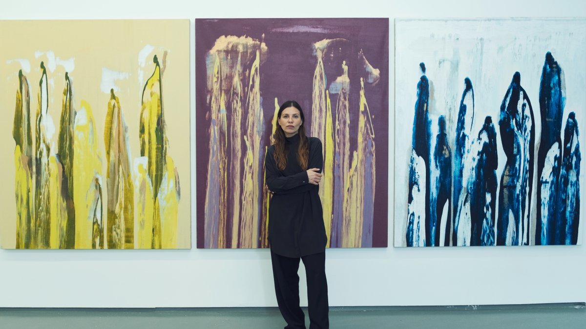 Nilüfer Yıldırım poses with her artworks. (Photo credit: Çetin Araç)
