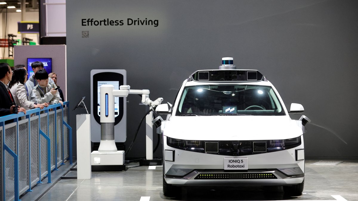 A Hyundai Ioniq 5 robotaxi, an electric, self-driving vehicle, is charged in the Hyundai Motor Group booth during CES 2026, an annual consumer electronics trade show, in Las Vegas, Nevada, U.S. Jan. 6, 2026. (Reuters Photo)