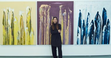 Nilüfer Yıldırım poses with her artworks. (Photo credit: Çetin Araç)