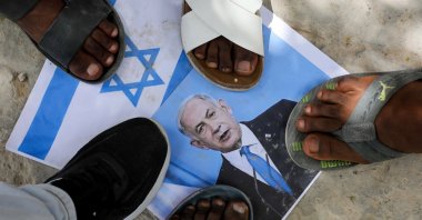 Somalis step on an image depicting Israeli Prime Minister Benjamin Netanyahu, during a demonstration after Israel became the first country to formally recognize the self-declared Republic of Somaliland as an independent and sovereign state, Mogadishu, Somalia, Dec. 30, 2025. (Reuters Photo)