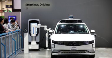 A Hyundai Ioniq 5 robotaxi, an electric, self-driving vehicle, is charged in the Hyundai Motor Group booth during CES 2026, an annual consumer electronics trade show, in Las Vegas, Nevada, U.S. Jan. 6, 2026. (Reuters Photo)