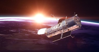 The Hubble Space Telescope in orbit above Earth. (Shutterstock Photo)