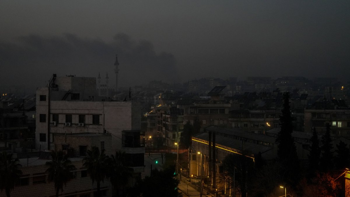 Smoke billows in the distance amid clashes, Aleppo, northern Syria, Jan. 7, 2026. (EPA Photo)