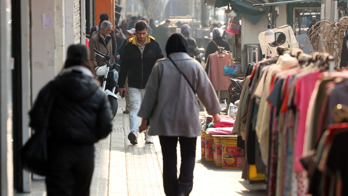 Iranians walk on a street in Tehran, Iran, Jan. 8, 2026. (EPA Photo)