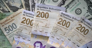 A picture of Venezuelan bolivar and dollar bills taken in Caracas, Venezuela, Sept. 30, 2025. (AFP Photo)