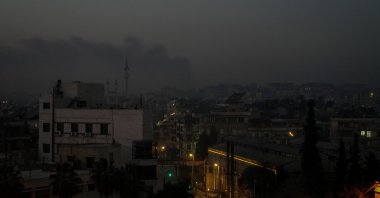 Smoke billows in the distance amid clashes, Aleppo, northern Syria, Jan. 7, 2026. (EPA Photo)
