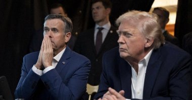 A photograph posted by U.S. President Donald Trump on his Truth Social account shows him sitting next to CIA Director John Ratcliffe as they watch the U.S. military operation in Venezuela from Trump's Mar-a-Lago resort, Palm Beach, Florida, U.S., Jan. 3, 2026. (Reuters Photo)