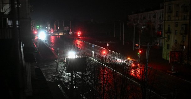 Cars move along a dark street during a power blackout in Zaporizhzhia, Ukraine, Jan. 7, 2026. (Reuters Photo)