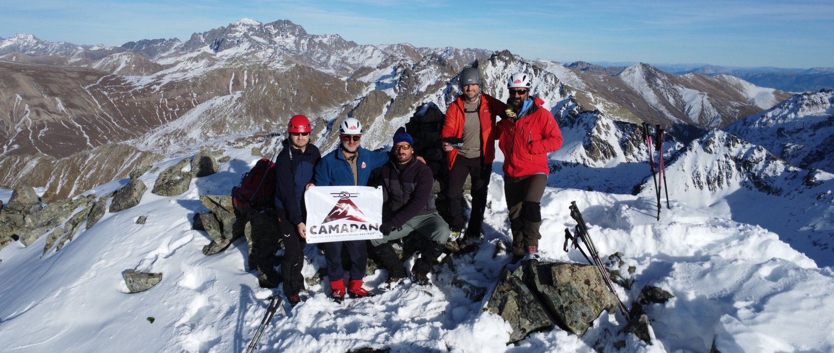 CAMADAN Mountaineering and Winter Sports Specialized Club President Metin Çolak (second left) and club member Hakan Demirci (left) pose for a photo, Kaçkar Mountains, in this photo released on Jan. 8, 2026. (AA Photo)