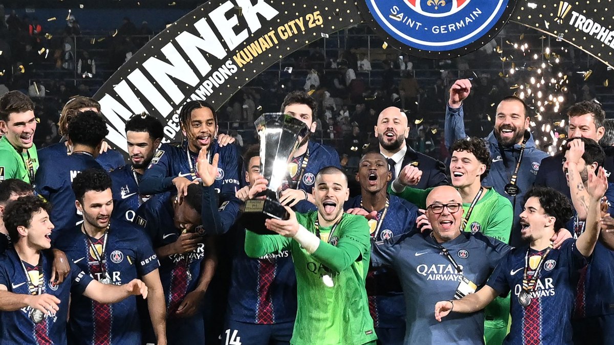 Paris Saint-Germain's Lucas Chevalier (C) and teammates celebrate with the trophy after winning the French Champions' Trophy (Trophee des Champions) match against Olympique de Marseille (OM) at the Jaber Al-Ahmad International Stadium, Kuwait City, Kuwait, Jan. 8, 2026. (AFP Photo)