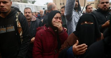 A Palestinian woman reacts as families arrive to collect the bodies of loved ones, the day after the Israeli military shelling killed over a dozen people, including children, at the Nasser Hospital, Khan Younis, Palestine, Jan. 9, 2026. (AFP Photo)