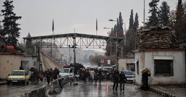 Residents of the Sheikh Maqsoud neighborhood in Aleppo leave the area through a humanitarian corridor opened by the Syrian government, northern Syria, Jan. 9, 2026. (EPA Photo)