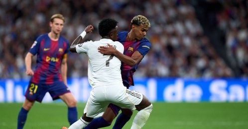 Barcelona's Lamine Yamal (L) battles for possession with Real Madrid's Vinicius Junior during the La Liga match at Estadio Santiago Bernabeu, Madrid, Spain, Oct. 26, 2025. (Getty Images Photo)