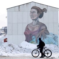 A man passes a building with social housing with an Inuit mural in Nuuk, Greenland, March 27, 2025. (Reuters Photo)