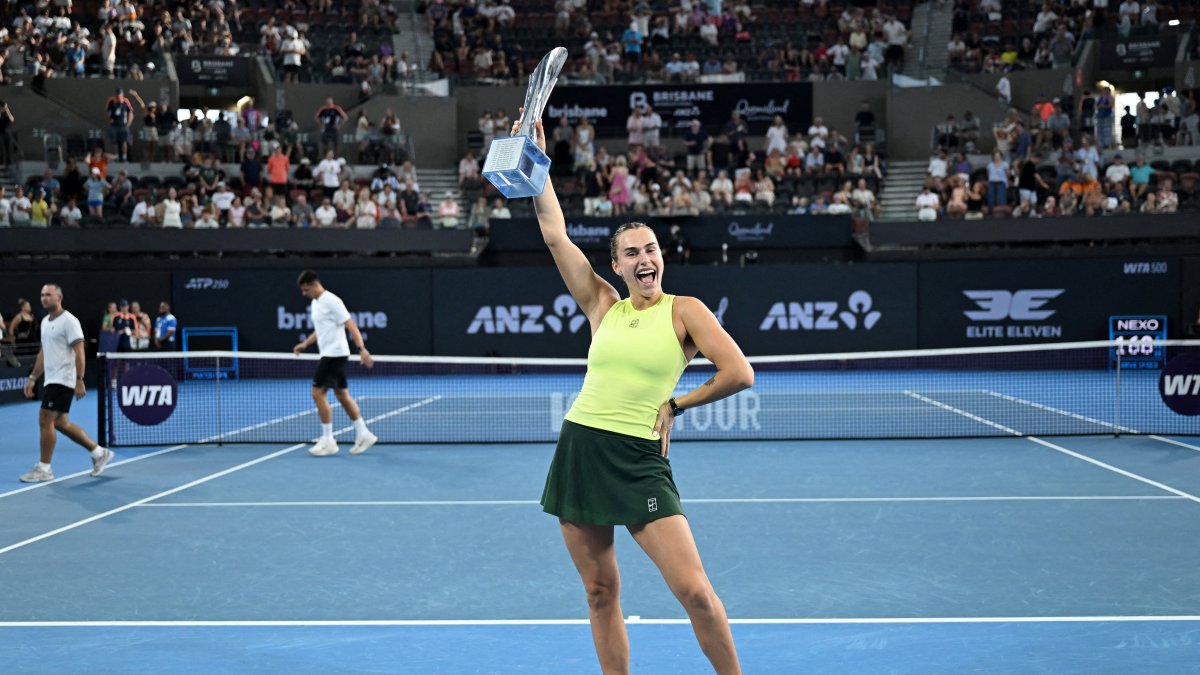 Belarus' Aryna Sabalenka celebrates with the trophy after winning the final against Ukraine's Marta Kostyuk, Brisbane, Australia, Jan. 11, 2026. (Reuters Photo)