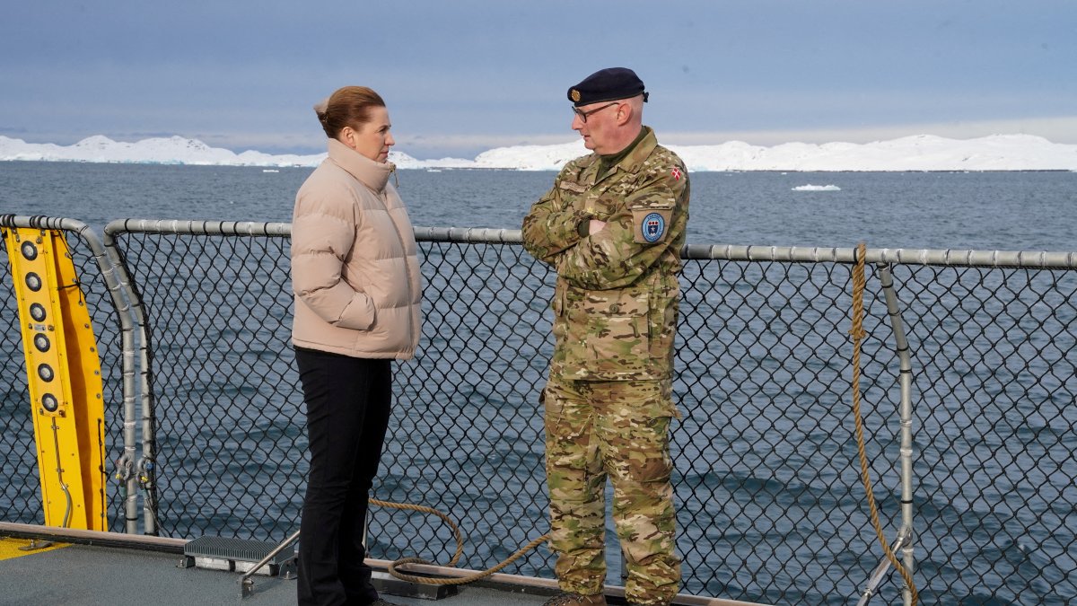 Denmark's Prime Minister Mette Frederiksen talks with the head of the Arctic Command Soeren Andersen, aboard the Defense's inspection vessel Vaedderen in the waters around Nuuk, Greenland, April 3, 2025.  (Reuters Photo)