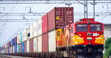A freight train carrying cargo containers rides along a railway track in Ajmer, India, Aug. 26, 2025. (AFP Photo)