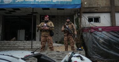 Syrian military police personnel stand guard following clashes with the PKK/YPG terrorist group, in the Sheikh Maqsoud neighborhood, Aleppo, Syria, Jan. 11, 2026. (EPA Photo)