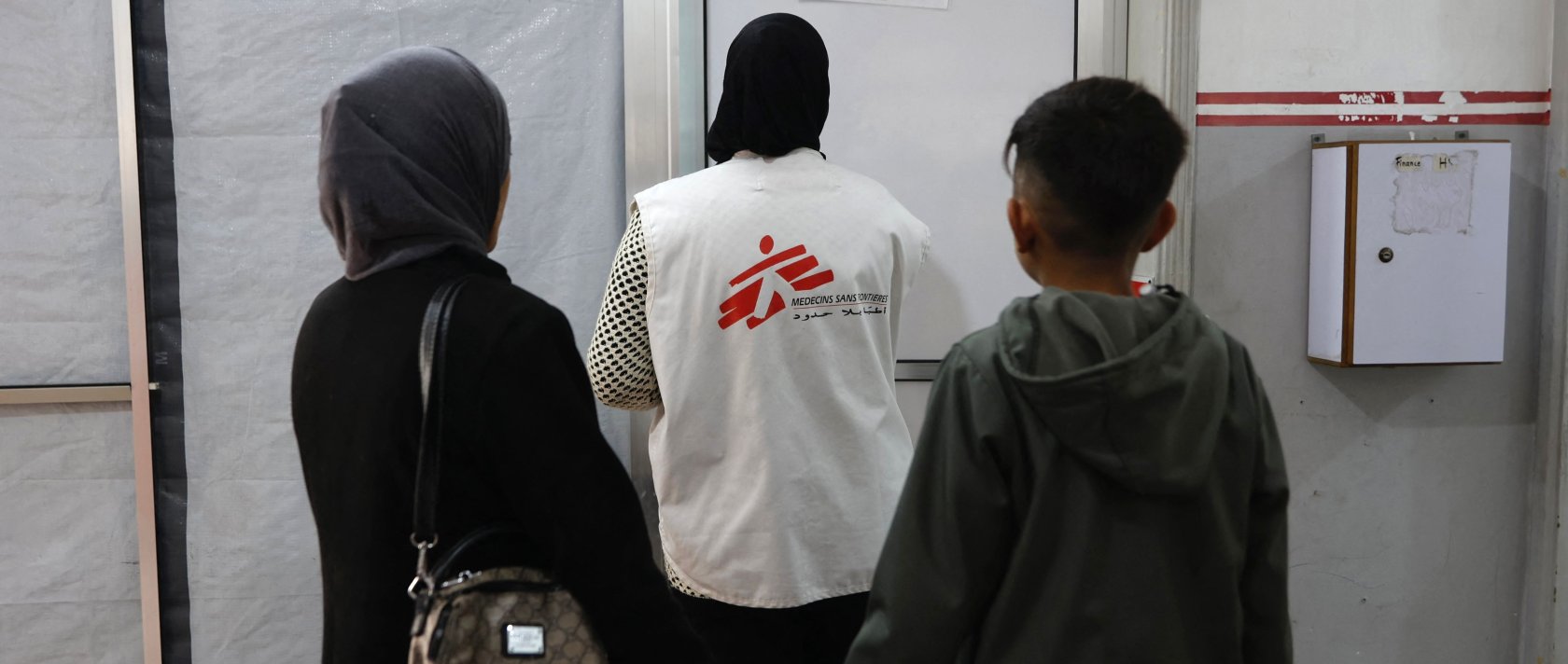 Patients follow a member of staff at a Medecins Sans Frontieres (MSF) clinic, in the al-Rimal neighborhood of Gaza City, Palestine, Dec. 31, 2025. (AFP Photo)