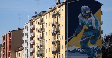 A residential building is seen with a mural of a paralympian pictured ahead of the Winter Olympics, Milan, Italy, Jan. 6, 2026. (Reuters Photo)