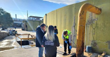 Inspectors collect wastewater samples during an environmental audit in the Gediz Basin, Manisa, Türkiye, Jan. 12, 2026. (AA Photo)
