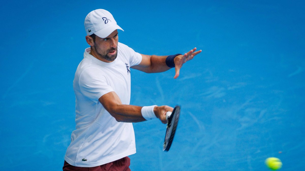 Serbia’s Novak Djokovic hits a forehand during a training session against Czechia's Jiri Lehecka in preparation for the Australian Open, Melbourne, Australia, Jan. 13, 2026. (AFP Photo)