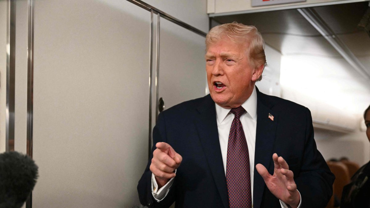 US President Donald Trump speaks to the press aboard Air Force One, Jan. 11, 2026. (AFP Photo)