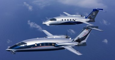 Piaggio Aerospace's P180 light transport aircraft are seen in the air. (Courtesy of Piaggio Aerospace)