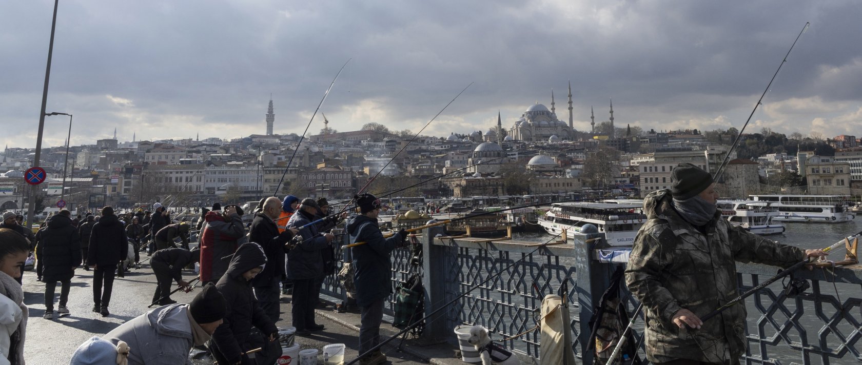People use fishing rods on the Galata Bridge over the Golden Horn, Istanbul, Türkiye, Jan. 13, 2026. (EPA Photo)