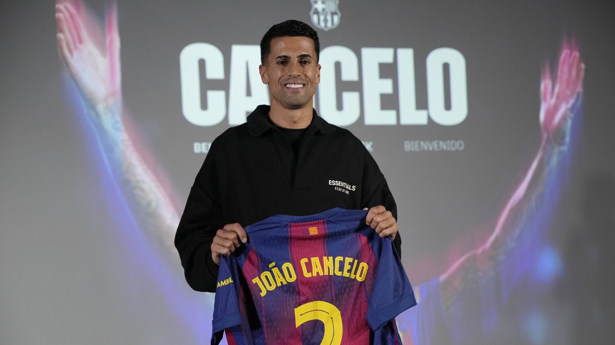Portuguese defender Joao Cancelo poses during his presentation as FC Barcelona's new player, Barcelona, Spain, Jan. 13, 2026. (EPA Photo)