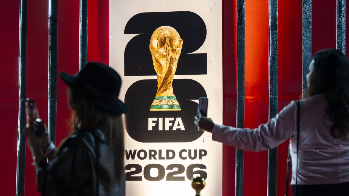 The FIFA World Cup trophy is displayed as part of a special tour ahead of the 2026 tournament to be hosted by the United States, Canada and Mexico, with football fans gathering to view the trophy and pose for photographs, Guwahati, India, Jan. 13, 2026. (AA Photo)