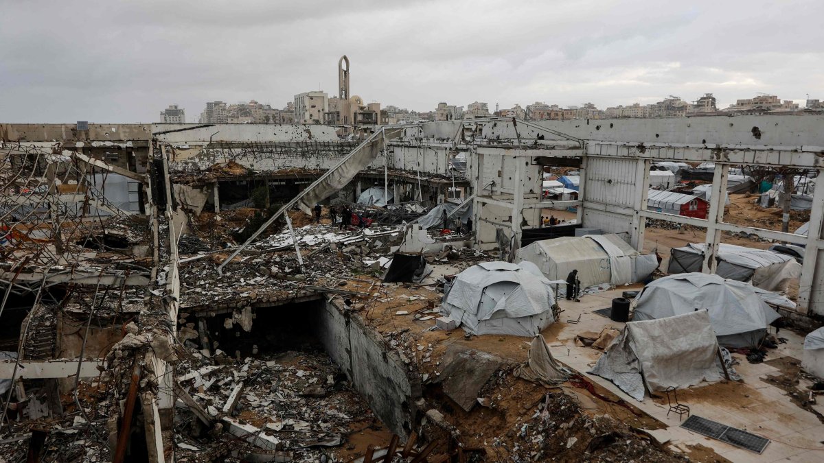 A photograph shows makeshift shelters inside a war-damaged building, parts of which collapsed on a windy winter day in Gaza City, the Gaza Strip, Jan. 13, 2026. (AFP Photo)