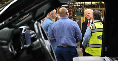 U.S. President Donald Trump speaks with Ford CEO Jim Farley (R) and plant manager Corey Williams (2nd L) as he tours Ford Motor Company's River Rouge complex in Dearborn, Michigan, U.S., Jan. 13, 2026. (AFP Photo)
