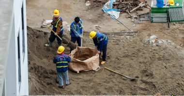 Laborers work at a construction site, Hanoi, Vietnam, Jan. 2, 2026. (EPA Photo)