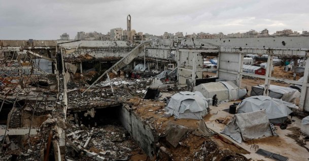 A photograph shows makeshift shelters inside a war-damaged building, parts of which collapsed on a windy winter day in Gaza City, the Gaza Strip, Jan. 13, 2026. (AFP Photo)