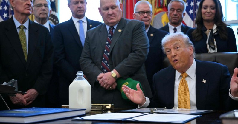 U.S. President Donald Trump jokes with attendees before signing bills in the Oval Office of the White House in Washington, D.C., Jan. 14, 2026. (AFP Photo)