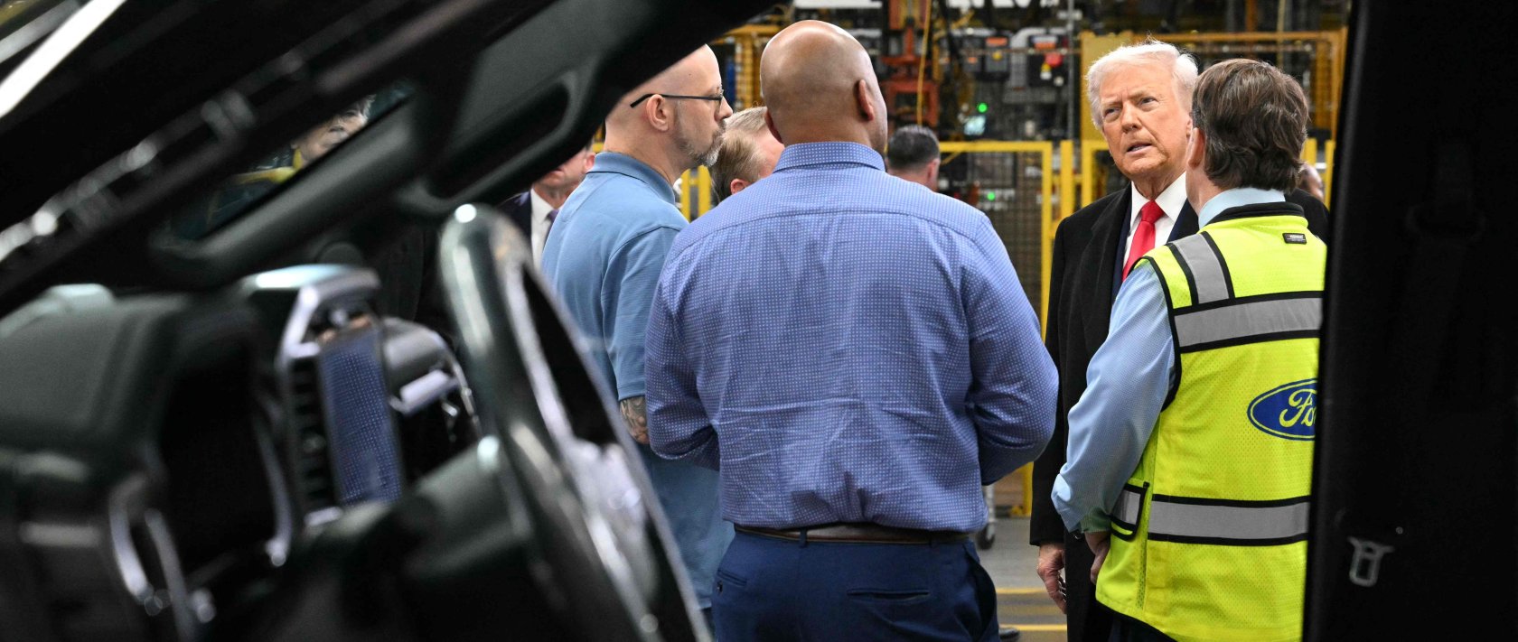 U.S. President Donald Trump speaks with Ford CEO Jim Farley (R) and plant manager Corey Williams (2nd L) as he tours Ford Motor Company's River Rouge complex in Dearborn, Michigan, U.S., Jan. 13, 2026. (AFP Photo)