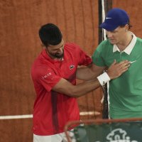 Winner Italy's Jannik Sinner (R) and Serbia's Novak Djokovic greet each other after their semifinal match of the French Tennis Open at the Roland-Garros stadium, Paris, France, June 6, 2025. (AP Photo)