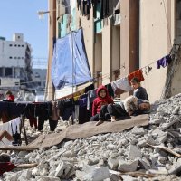 Laundry hangs on lines strung across the rubble of destroyed buildings where displaced Palestinian families set up their home shelters, in Gaza City, Jan. 11, 2026. (AFP Photo)