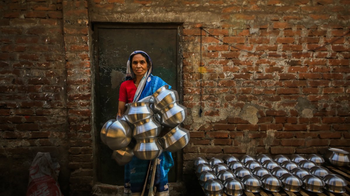Workers melt scrap aluminum into cookware in Bangladesh's Dhaka