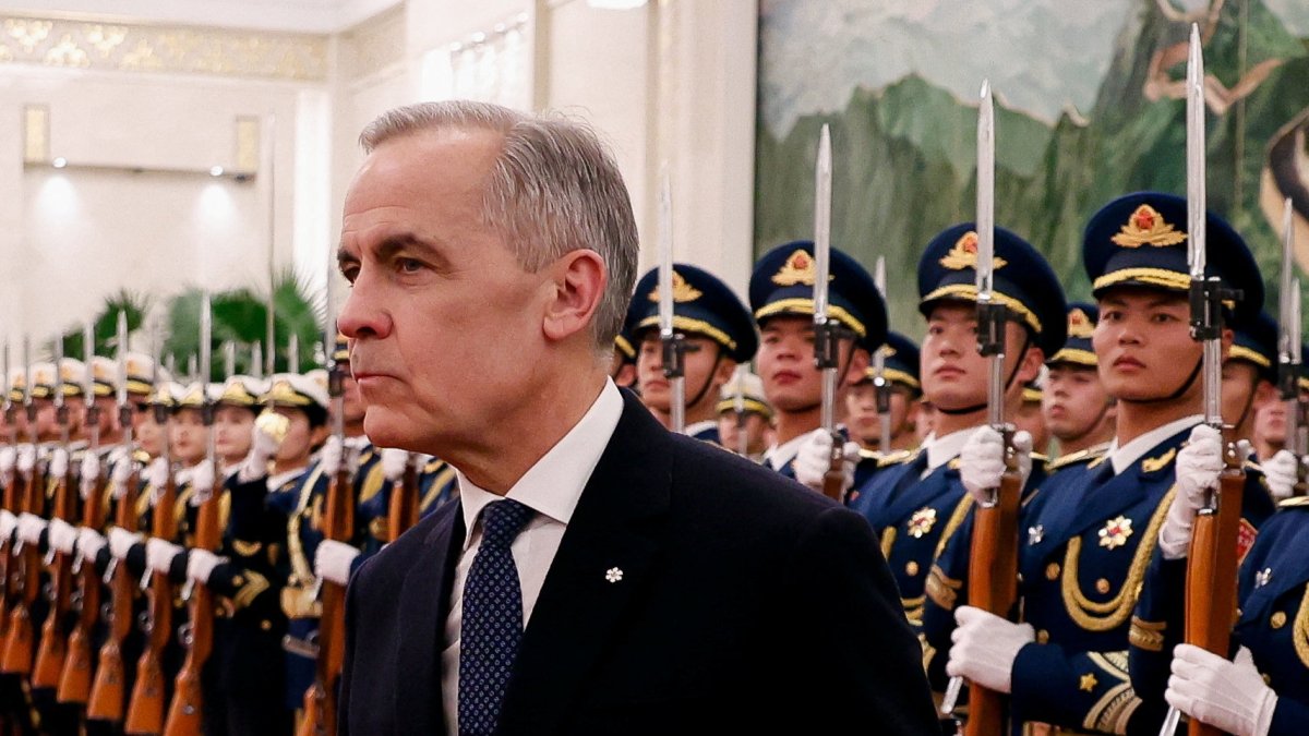 Canada's Prime Minister Mark Carney walks next to the honor guard in Beijing, China, Jan. 15, 2026. (Reuters Photo)