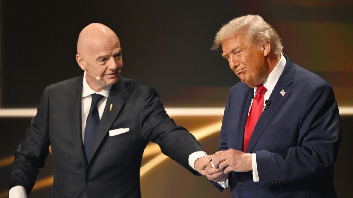 FIFA President Gianni Infantino pauses U.S. President Donald Trump during the draw for the 2026 football World Cup at the Kennedy Center in Washington, U.S., Dec. 5, 2025. (AP Photo)
