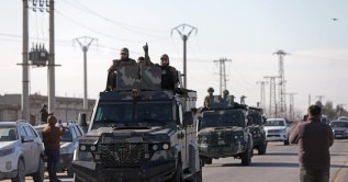 Syrian government military reinforcements arrive via the international M4 highway to the Deir Hafir area, Aleppo, Syria, Jan. 14, 2026. (AFP Photo) 