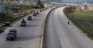 Military vehicles drive along a road, as Syrian state agency, SANA, reported that the Syrian army sent reinforcements from Latakia to army forces, amid escalating YPG threats, Latakia, Syria, Jan. 14, 2026. (Reuters Photo)
