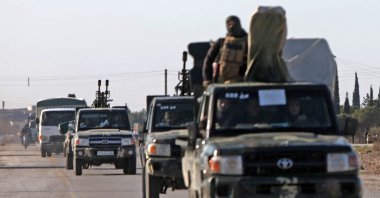 Syrian government military reinforcements arrive via the international M4 highway in the Deir Hafir area, Aleppo, Syria, Jan. 14, 2026. (AFP Photo)