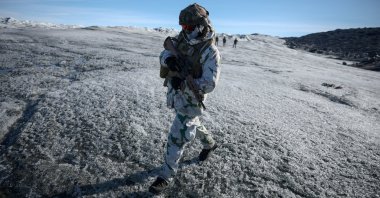 A member of the French armed forces walks on ice during a military drill in Kangerlussuaq, Greenland, Sept. 17, 2025. (Reuters Photo)