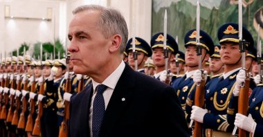 Canada's Prime Minister Mark Carney walks next to the honor guard in Beijing, China, Jan. 15, 2026. (Reuters Photo)