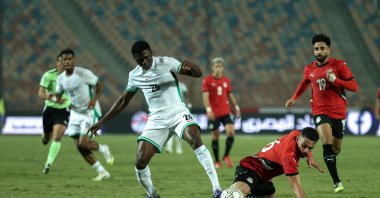Egypt's Mohamed Hany (2nd R) in action with Nigeria's Ebenezer Akinsanmiro at Cairo International Stadium, Cairo, Egypt, Dec. 16, 2025. (Getty Images Photo)